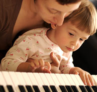 Child Playing Musical Instrument